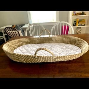 Like new woven changing basket. Has two (2) white changing pads.